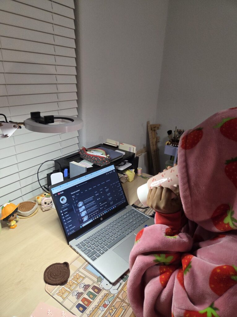 Being your own #1 fan means showing up for yourself. Kim is looking at her own videos on You tube while drinking a mug of tea